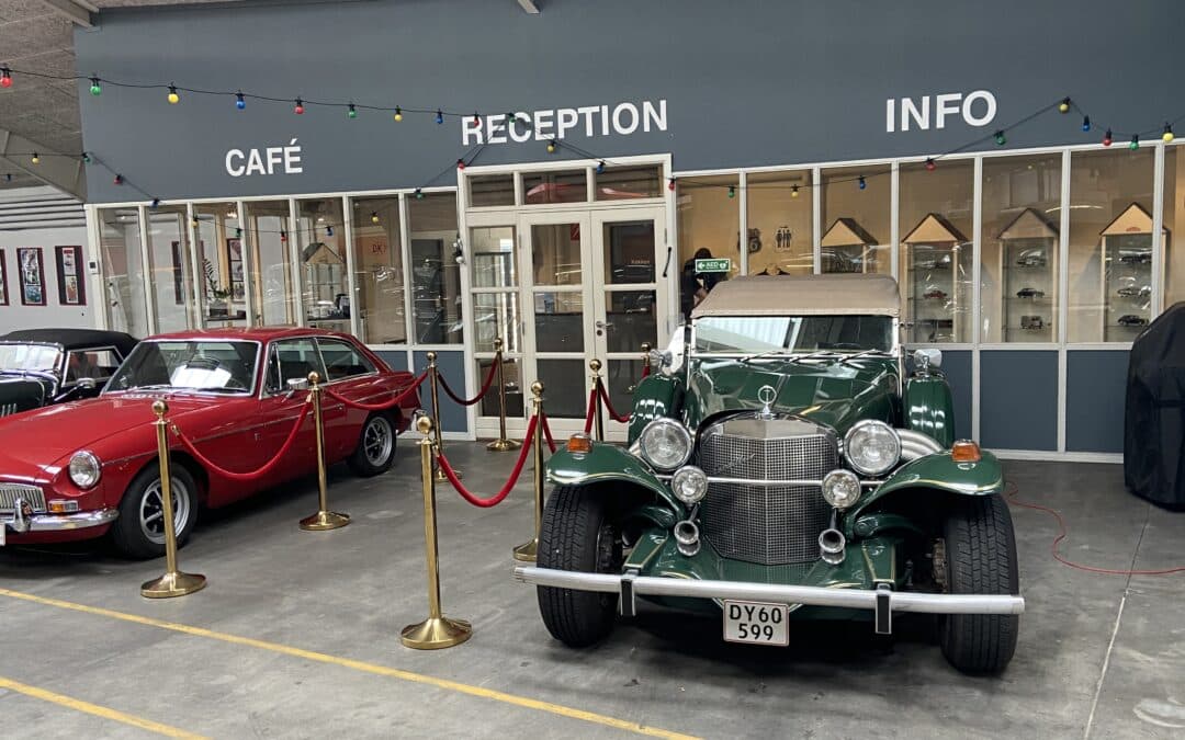 Vintage cars outside a shopfront